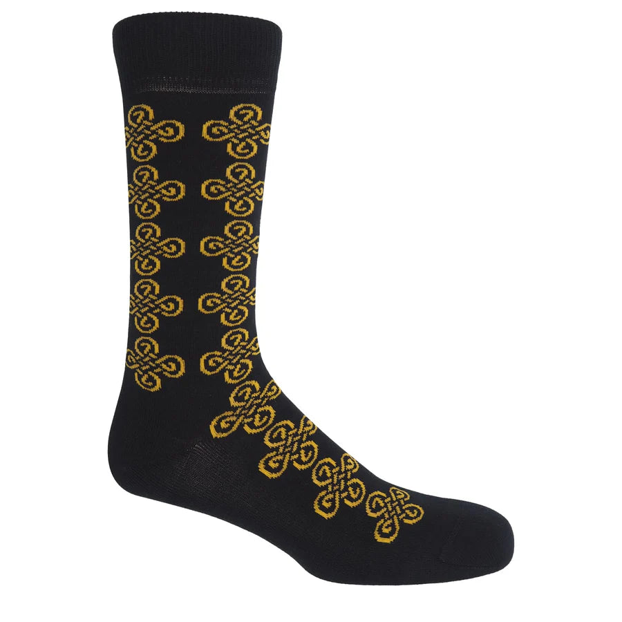 Black sock with yellow Celtic knot pattern on a white background